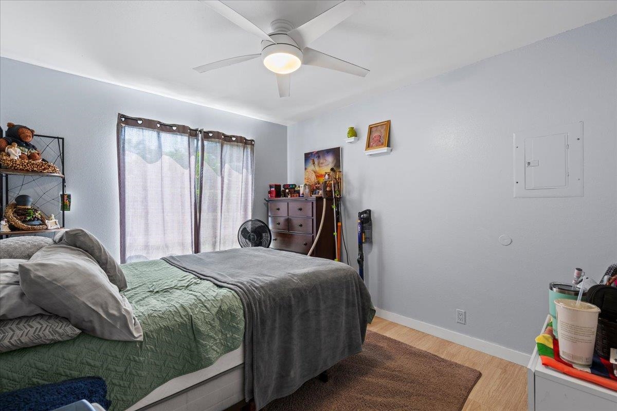 480 Kenolio Road, Unit 1103 Kihei, HI 96753 - Photo 25 of 32 a bedroom with a bed and a window