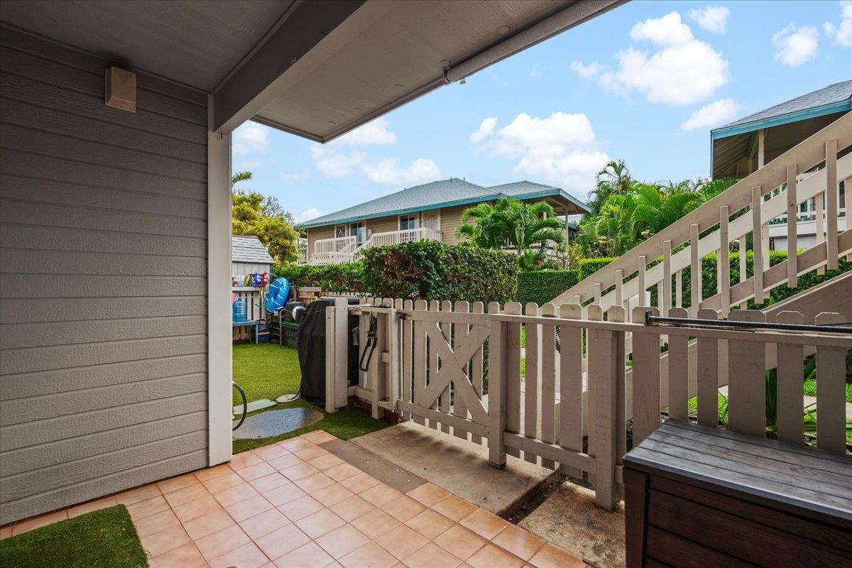 480 Kenolio Road, Unit 1103 Kihei, HI 96753 - Photo 26 of 32 a view of a wooden door with a chairs