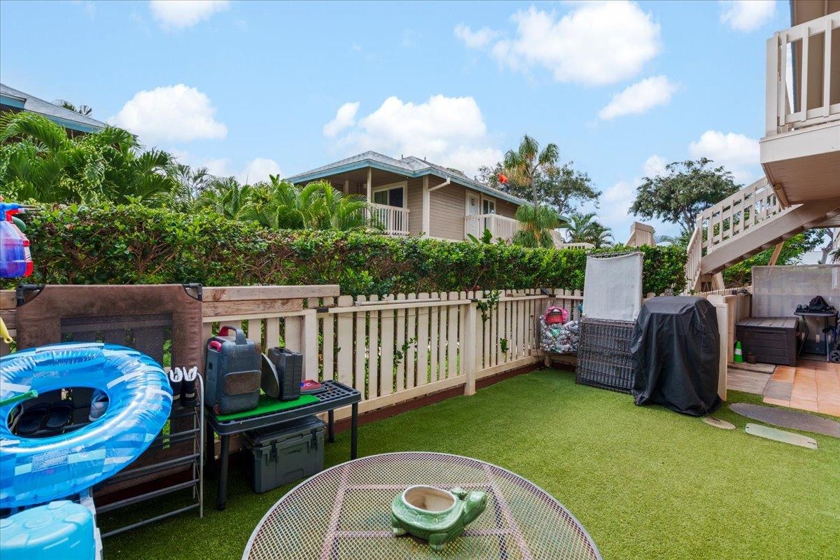 480 Kenolio Road, Unit 1103 Kihei, HI 96753 - Photo 28 of 32 a view of a patio with furniture