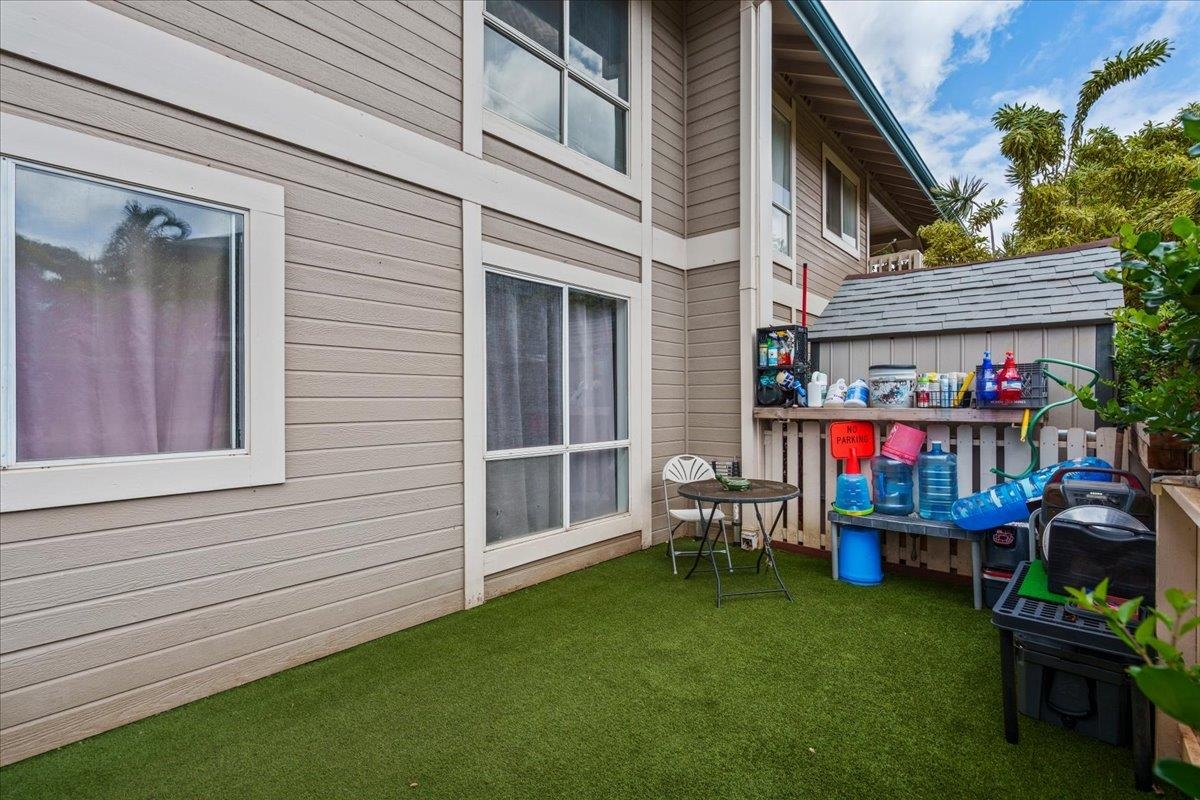 480 Kenolio Road, Unit 1103 Kihei, HI 96753 - Photo 29 of 32 a front view of house with outdoor seating and deck