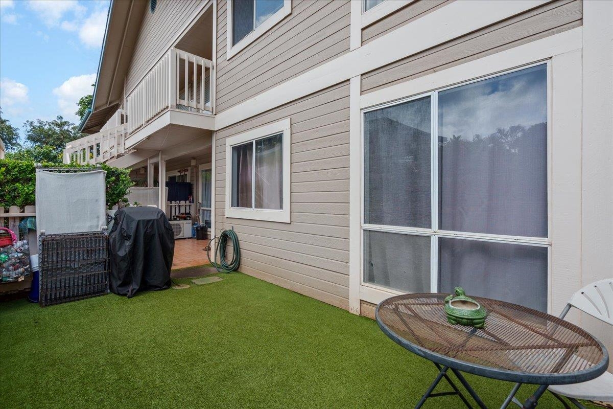 480 Kenolio Road, Unit 1103 Kihei, HI 96753 - Photo 30 of 32 a view of an outdoor space with seating area