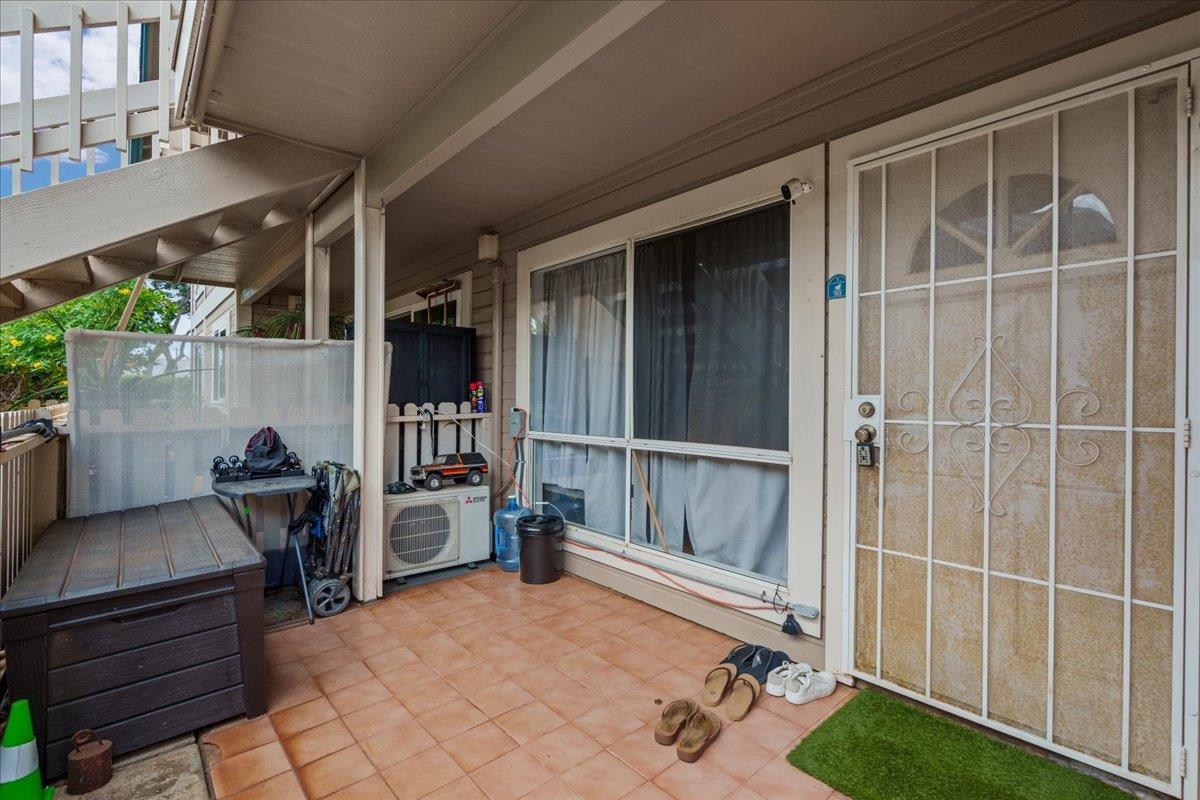 480 Kenolio Road, Unit 1103 Kihei, HI 96753 - Photo 3 of 32 a view of a living room and balcony