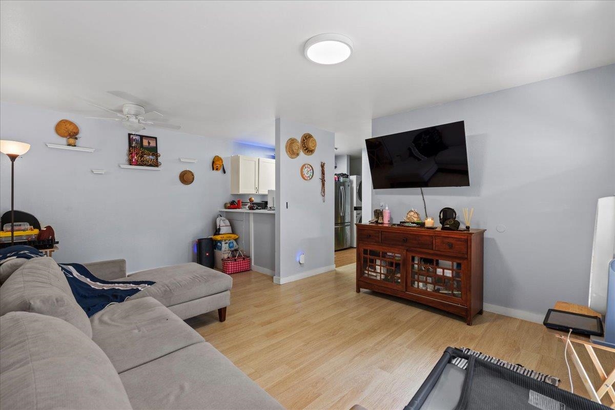 480 Kenolio Road, Unit 1103 Kihei, HI 96753 - Photo 8 of 32 a living room with furniture and a flat screen tv