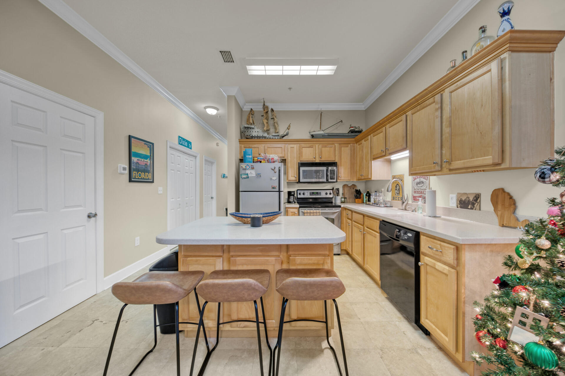 231 Somerset Bridge Road, Unit 2405 Santa Rosa Beach, FL 32459 - Photo 7 of 13 a kitchen with stainless steel appliances kitchen island granite countertop a sink and cabinets