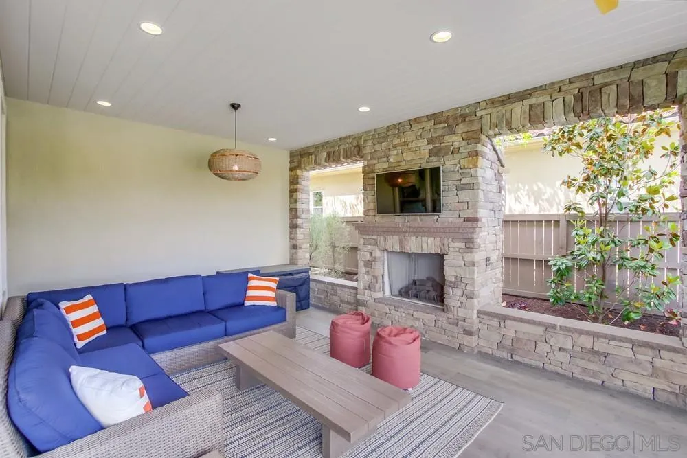15501 Tanner Ridge Road San Diego, CA 92127 - Photo 13 of 18 a living room with furniture and a fireplace