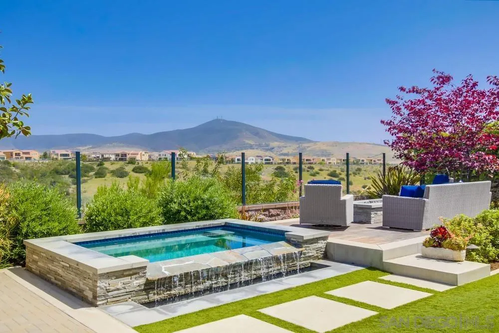 15501 Tanner Ridge Road San Diego, CA 92127 - Photo 15 of 18 a view of a patio with a table and chairs under an umbrella