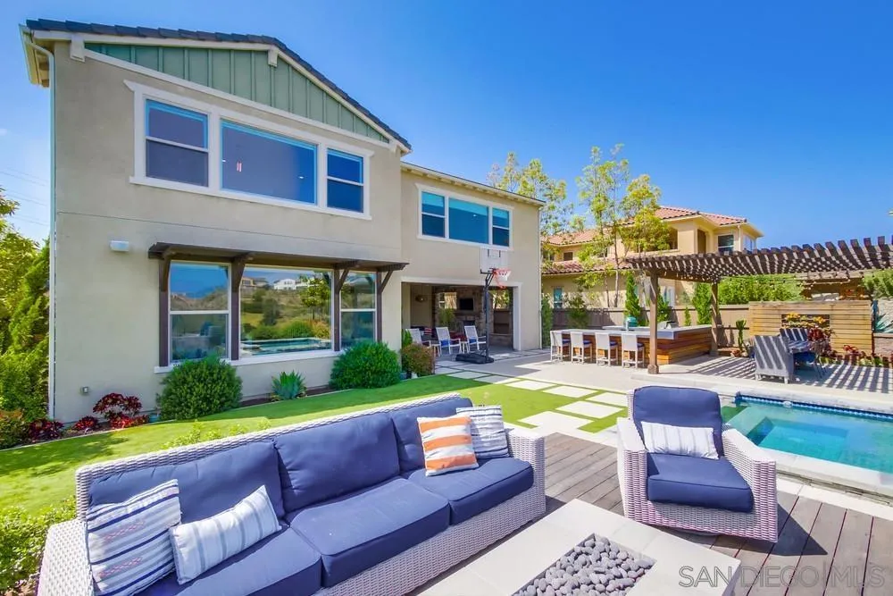 15501 Tanner Ridge Road San Diego, CA 92127 - Photo 17 of 18 a view of an house with backyard and furniture