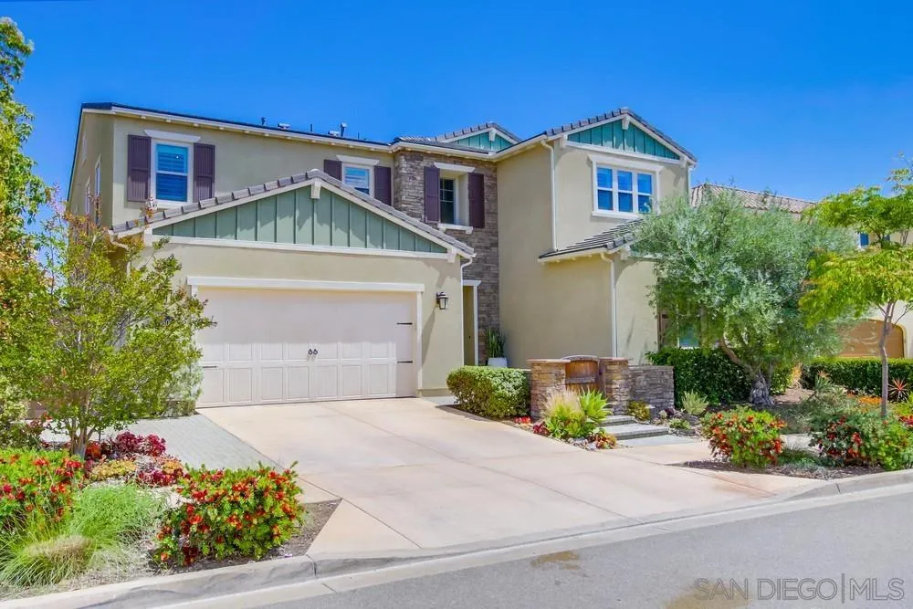15501 Tanner Ridge Road San Diego, CA 92127 - Photo 3 of 18 a front view of a house with a yard