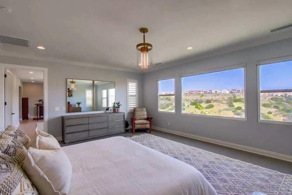 15501 Tanner Ridge Road San Diego, CA 92127 - Photo 9 of 18 a large bedroom with a large bed and windows