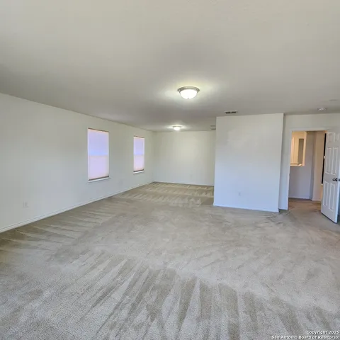 a bathroom with a tub sink and a mirror