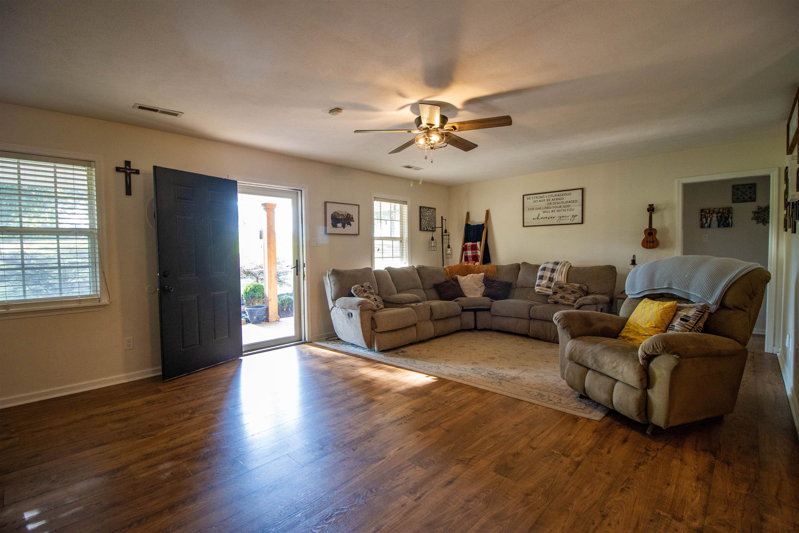120 Craig Road Ripley, TN 38063 - Photo 5 of 38 Spacious Great Room featuring wood-finish flooring, white baseboards, and a ceiling fan