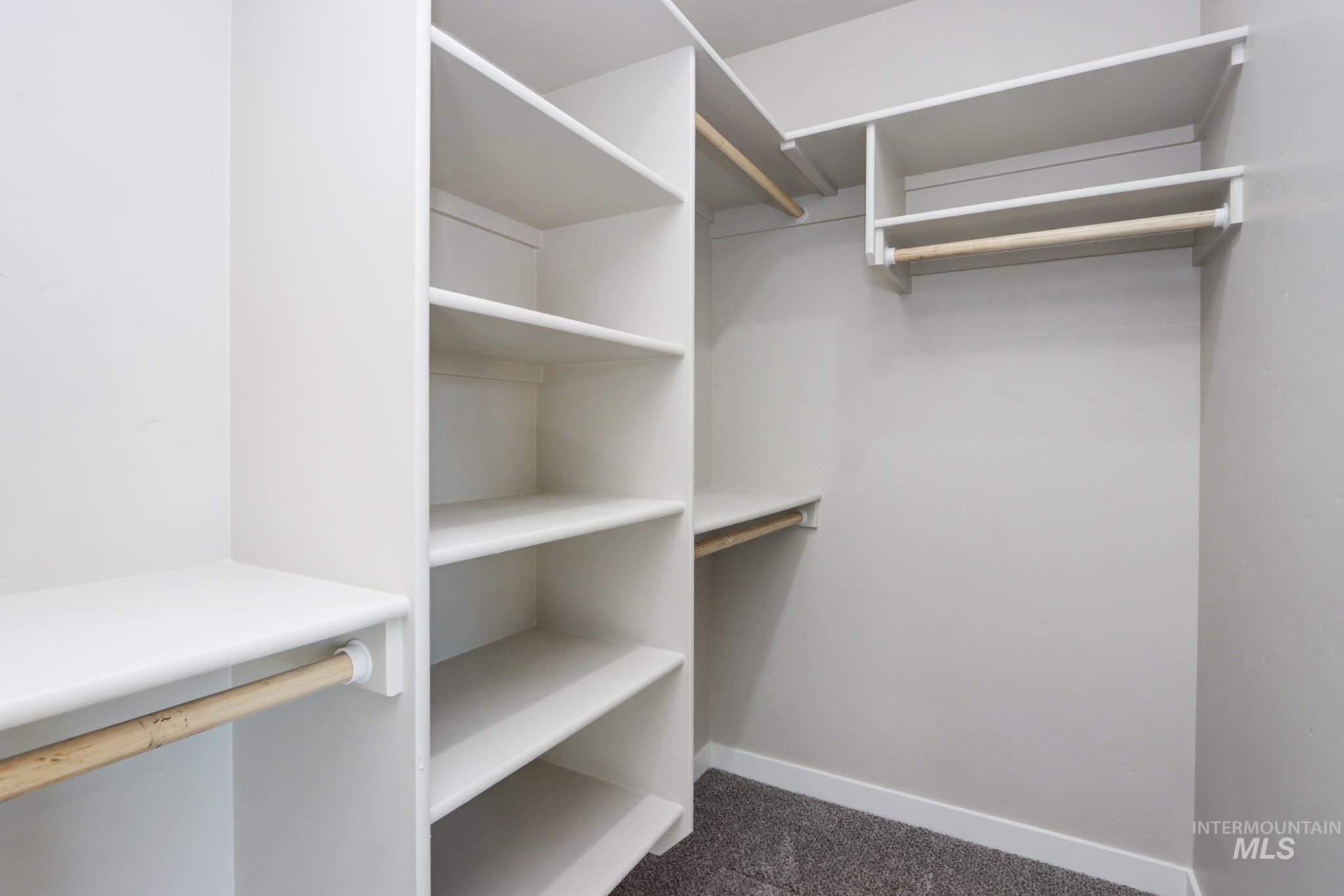 848 North 5th Street Nyssa, OR 97913 - Photo 32 of 49 Custom closet system featuring multiple white shelving units and natural wood-finish hanging rods