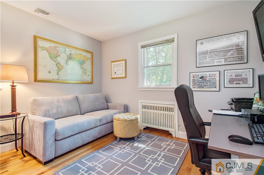 764 Old Raritan Road Edison, NJ 08820 - Photo 14 of 20 a living room with furniture a desk and chair with wooden floor