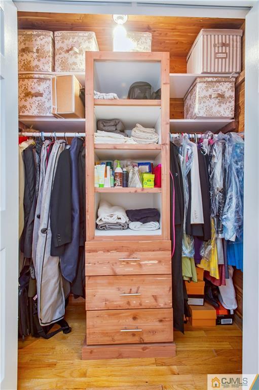 764 Old Raritan Road Edison, NJ 08820 - Photo 17 of 20 a view of walk in closet with clothes and shoes