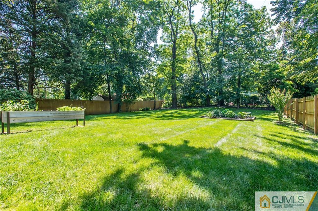 764 Old Raritan Road Edison, NJ 08820 - Photo 20 of 20 a view of a swimming pool with a garden