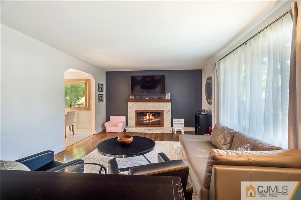 764 Old Raritan Road Edison, NJ 08820 - Photo 3 of 20 a living room with furniture and a fireplace