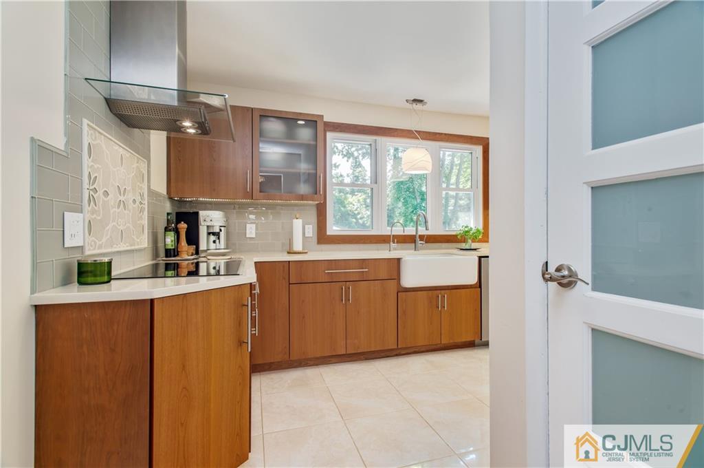 764 Old Raritan Road Edison, NJ 08820 - Photo 6 of 20 a kitchen with stainless steel appliances a sink and a stove