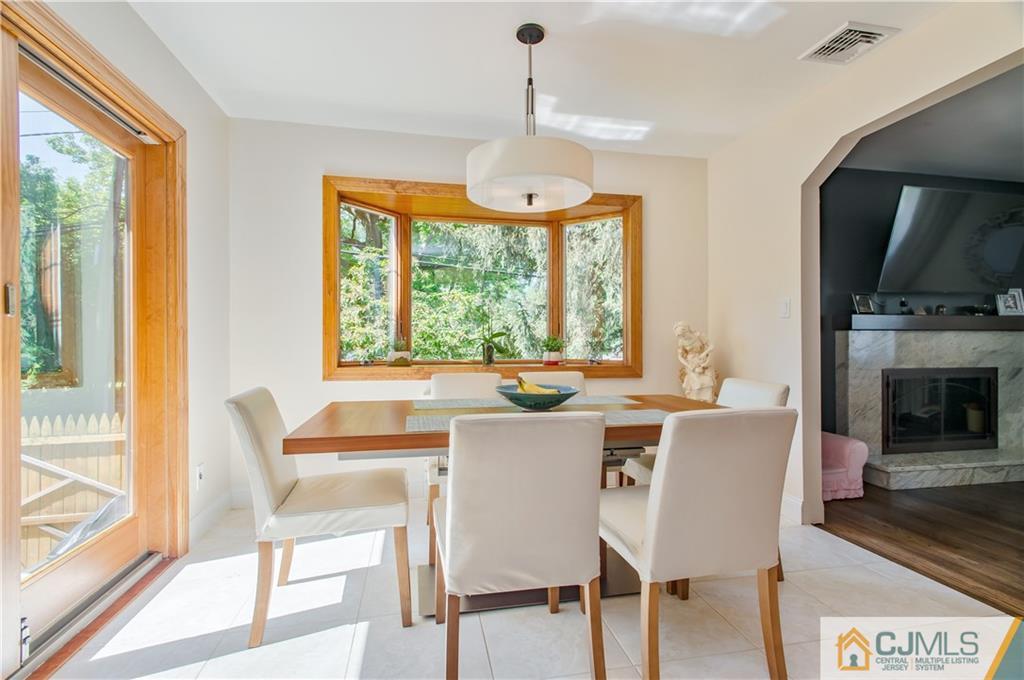 764 Old Raritan Road Edison, NJ 08820 - Photo 10 of 20 a view of a dining room with furniture window and outside view