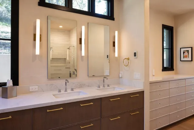 a bathroom with a sink and a mirror