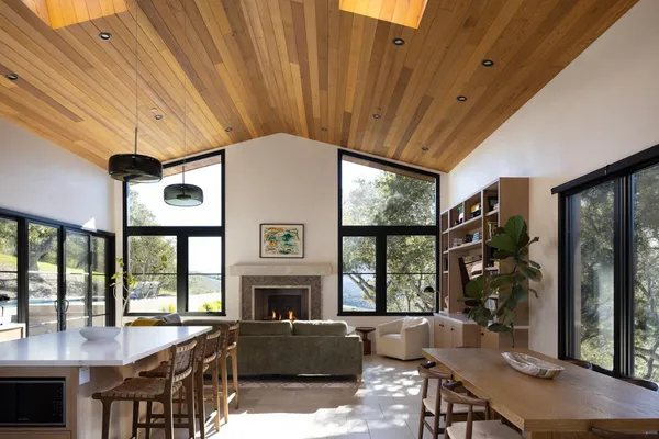 a living room with furniture a window and a fireplace
