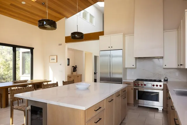 a kitchen with a stove and a refrigerator