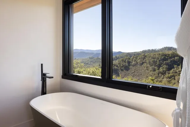 a view of a balcony next to a yard