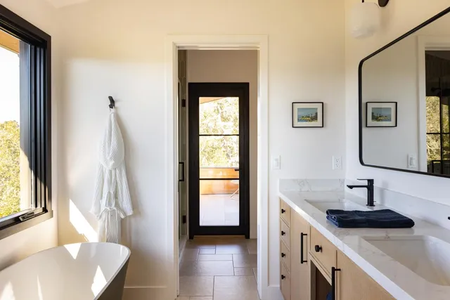 a bathroom with a sink and a window