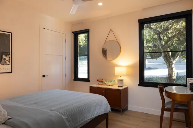 a bedroom with a bed and a window