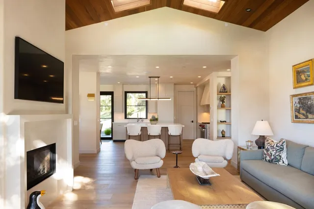 a living room with couches and a fireplace