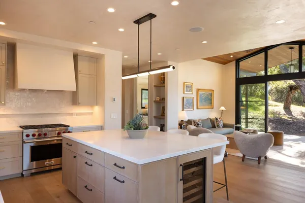 a kitchen with a stove a sink and a refrigerator