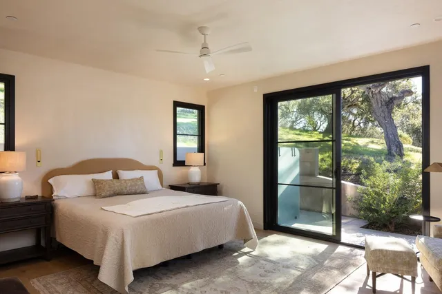 a bedroom with a bed and a lamp