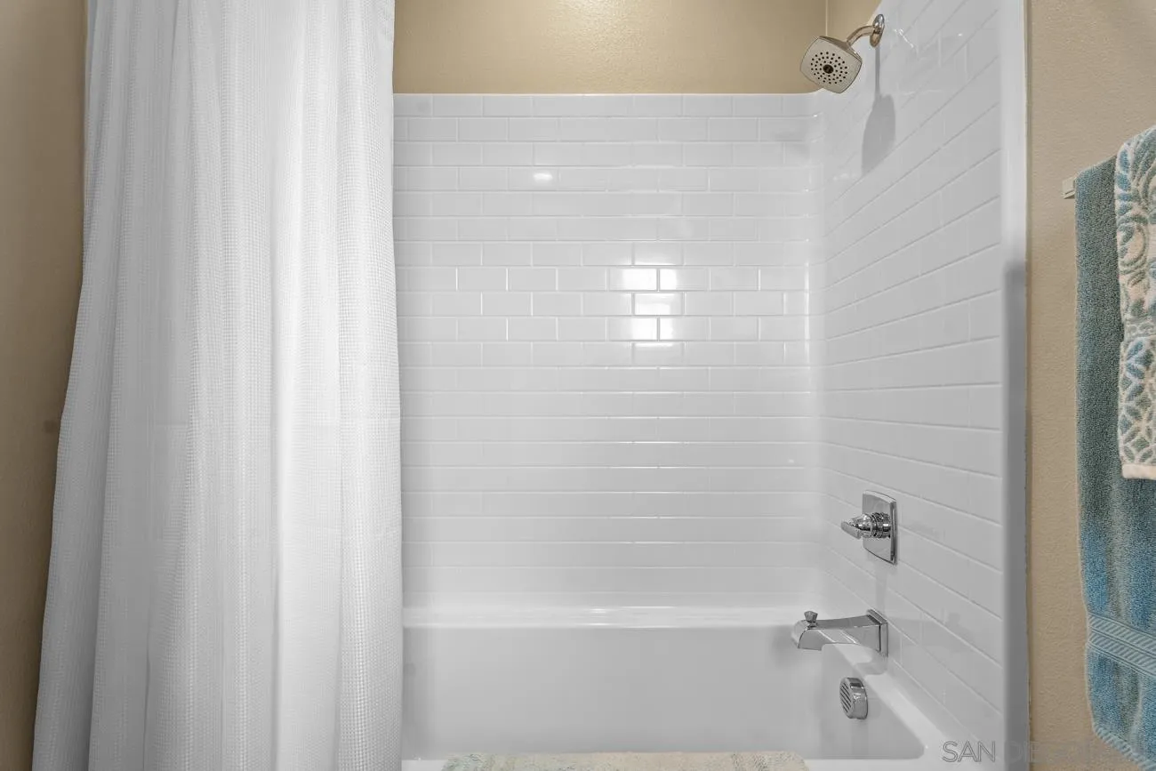 4326 Star Path Way, Unit 1 Oceanside, CA 92056 - Photo 34 of 46 a close up of a bathtub curtain