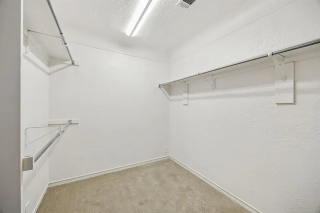 a view of a room with racks on the wall