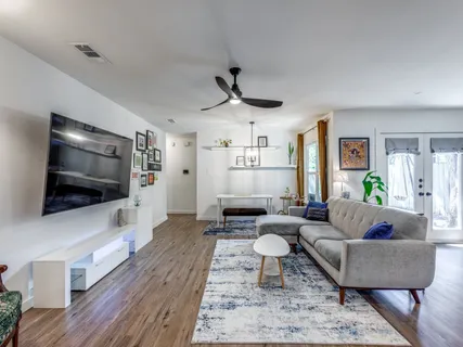 a living room with furniture and a flat screen tv