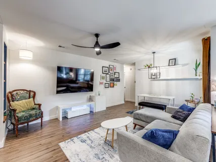 a living room with furniture and a flat screen tv
