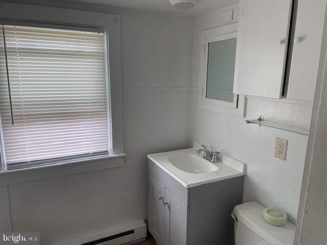 22429 Goose Street, Unit B Cavetown, MD 21783 - Photo 12 of 16 a bathroom with a sink a toilet and a mirror