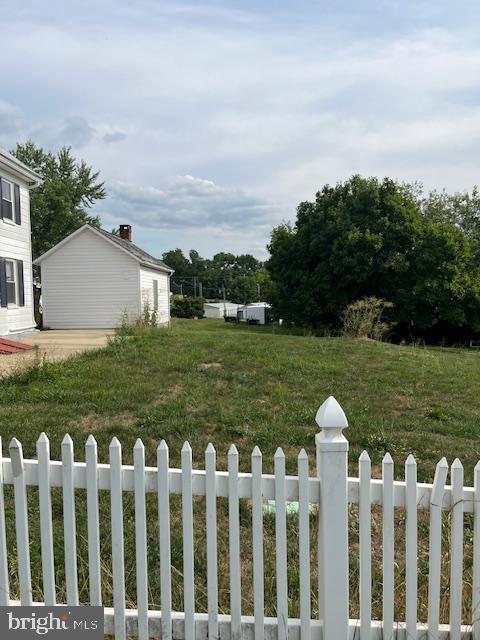 22429 Goose Street, Unit B Cavetown, MD 21783 - Photo 15 of 16 a front view of house with yard and trees