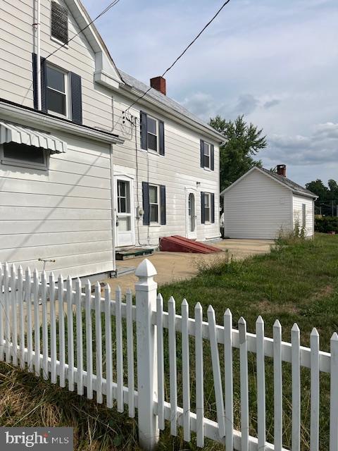 22429 Goose Street, Unit B Cavetown, MD 21783 - Photo 16 of 16 a front view of a house with a garden
