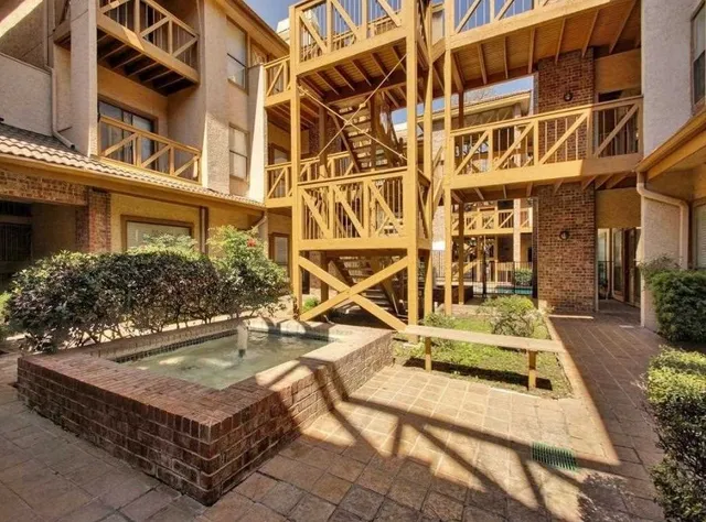 front view of a building with a bench