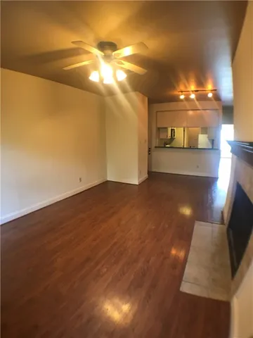 a view of an empty room with a mirror