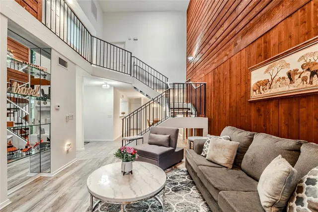 a living room with furniture and a painting