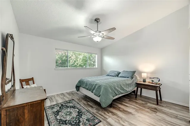 a bedroom with a bed and a table in it