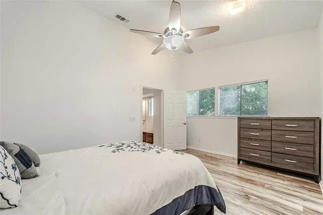 a bedroom with a bed and a window