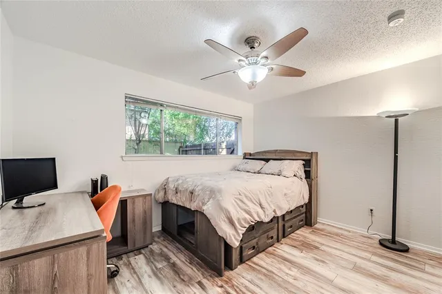 a bed room with a bed and a window