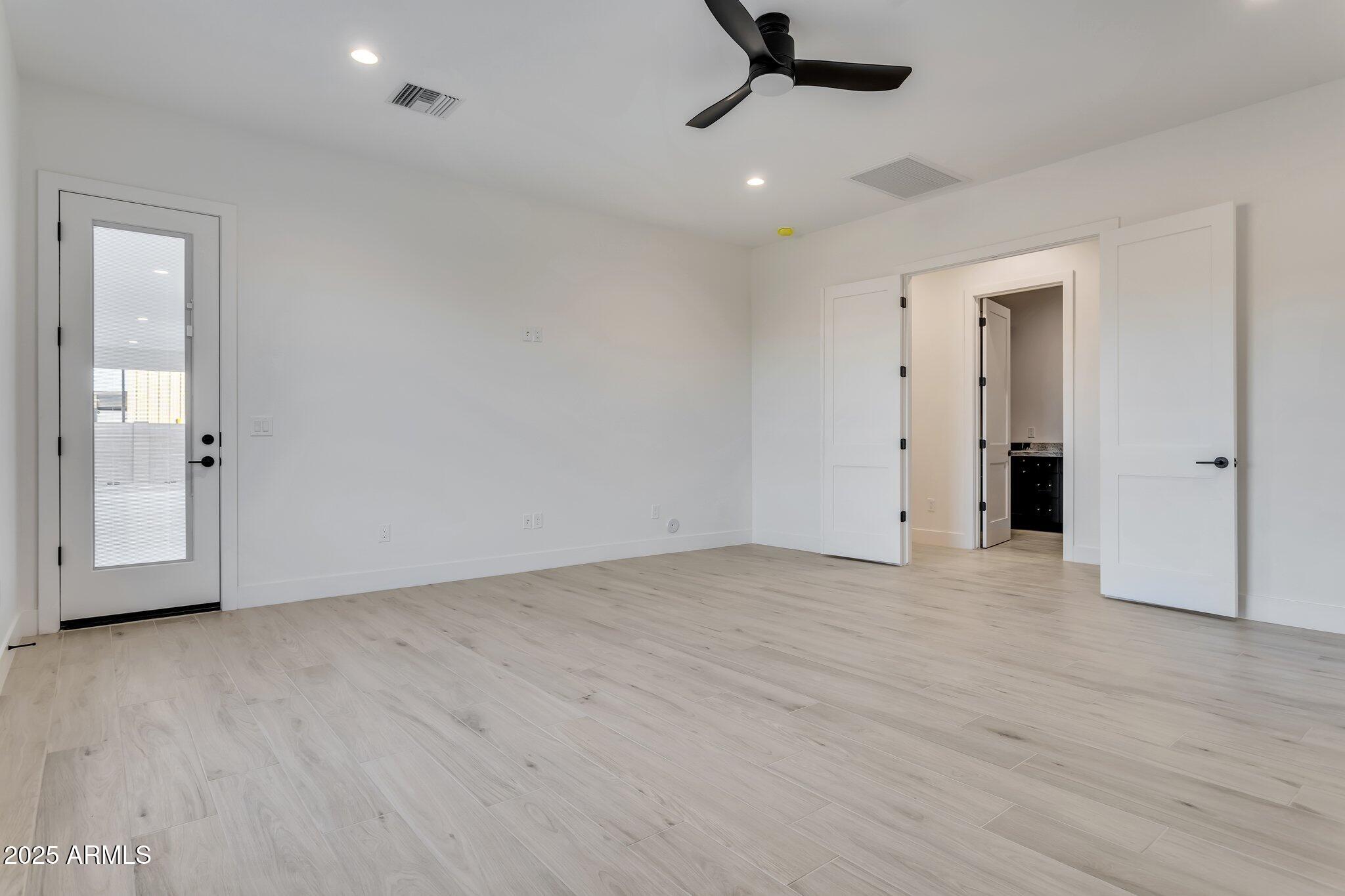 1602 East Cloud Road Phoenix, AZ 85086 - Photo 19 of 45 an empty room with a empty space and windows
