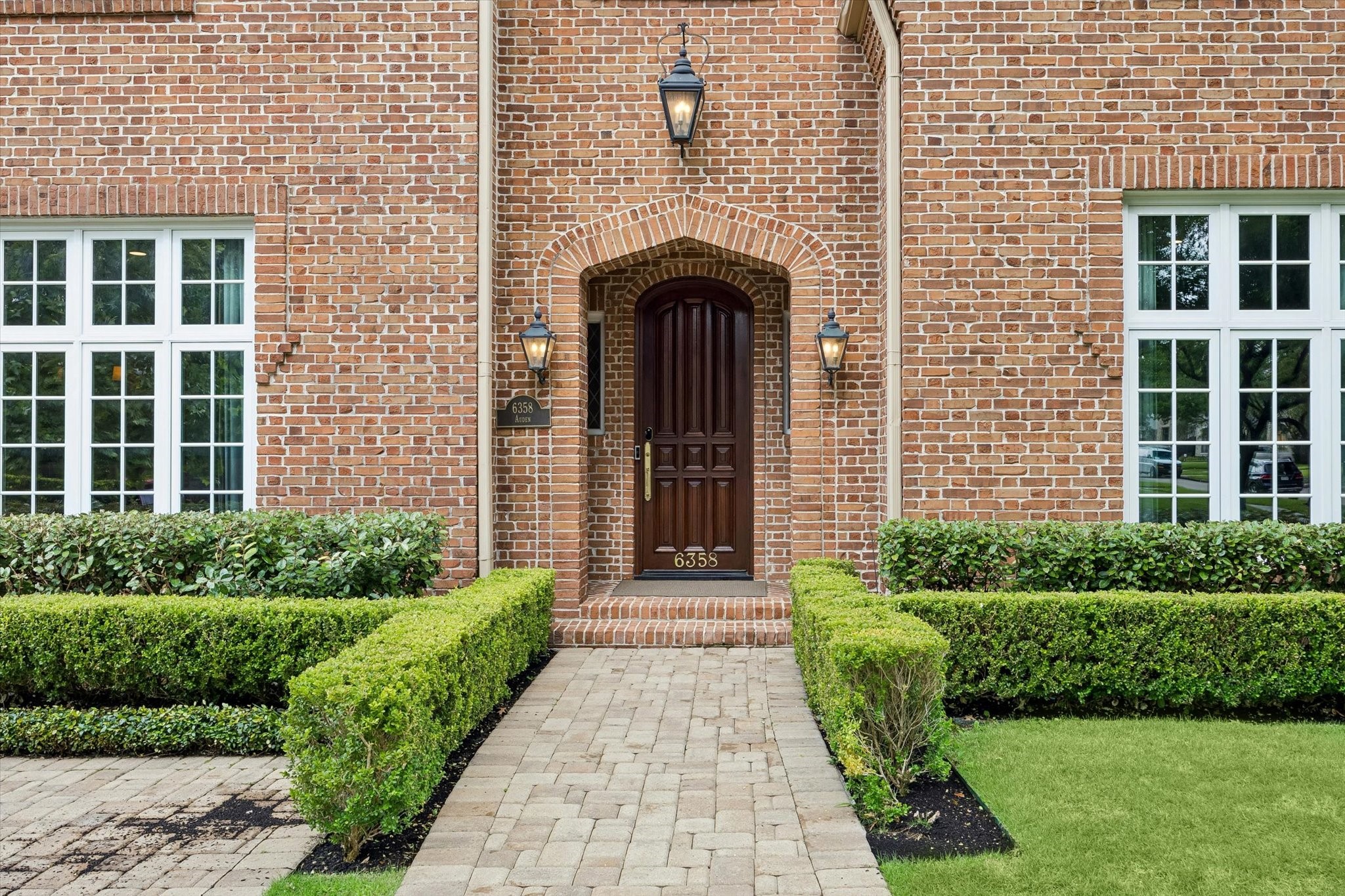 6358 Auden Street Houston, TX 77005 - Photo 2 of 50 a front view of a house with garden
