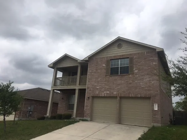 a front view of a house with garage