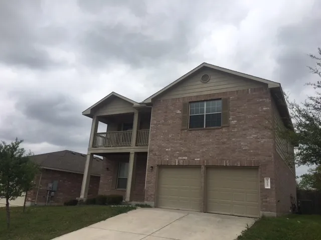 a front view of a house with garage
