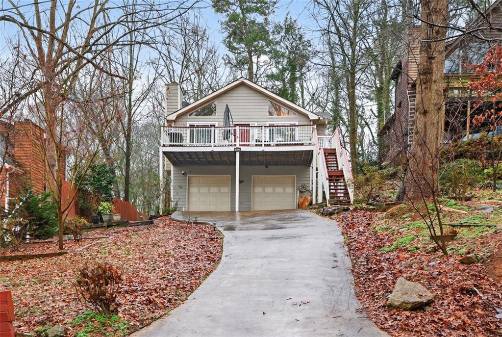 4509 Jane Road Southwest Snellville, GA 30039 - Photo 1 of 1 a front view of a house with a yard and garage