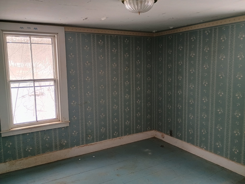 9 Olive Street Ashland, MA 01721 - Photo 19 of 33 an empty room with a window
